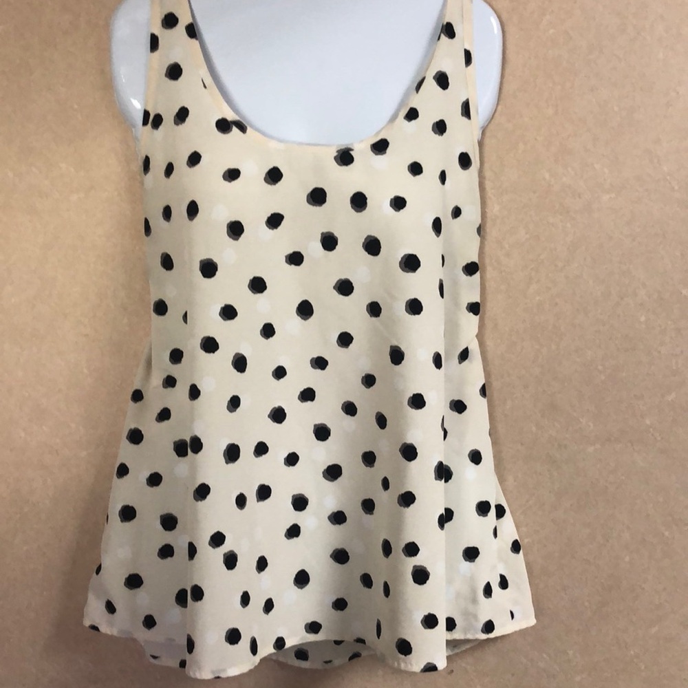 Apt 9 cream with grey, white and black pita dots.